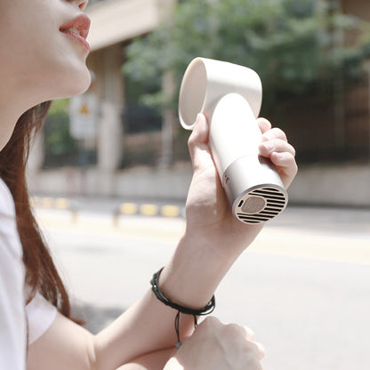 Portable mini bladeless fan